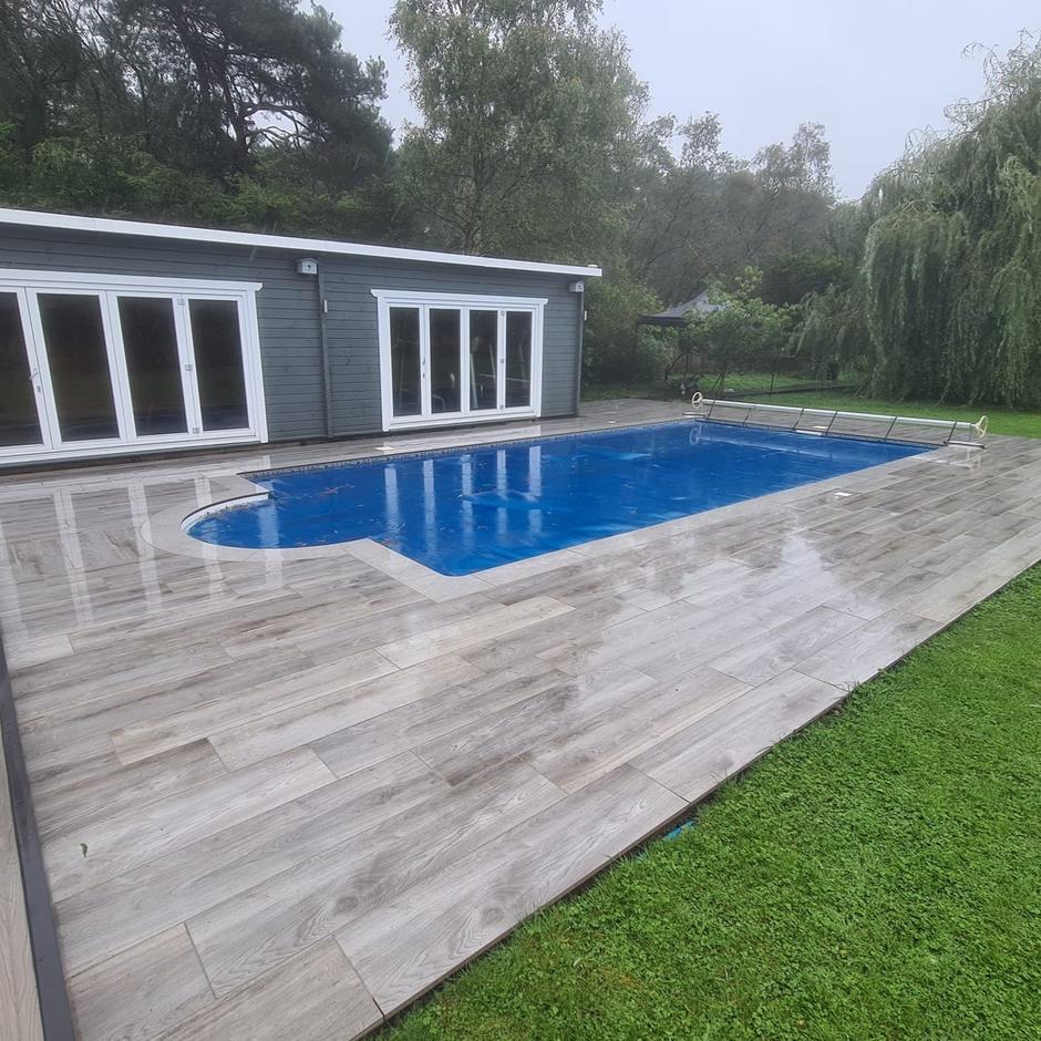 Woodland wood-effect Anthracite Grey Black Porcelain Paving Slab swimming pool area
