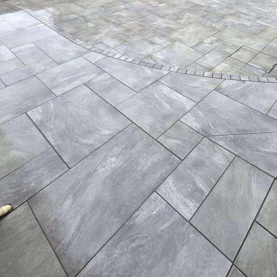 landscaping project with grey porcelain paving slabs