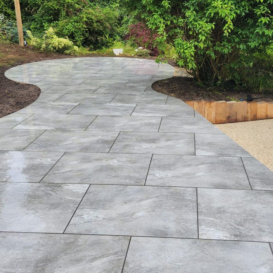 Sienna™ Jupiter Grey Porcelain Paving with plant border