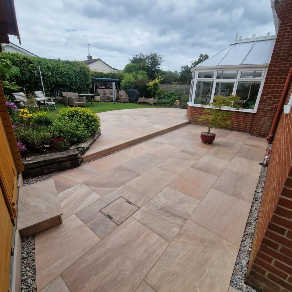 'Natural' Raveena Porcelain Paving with garden room and turf