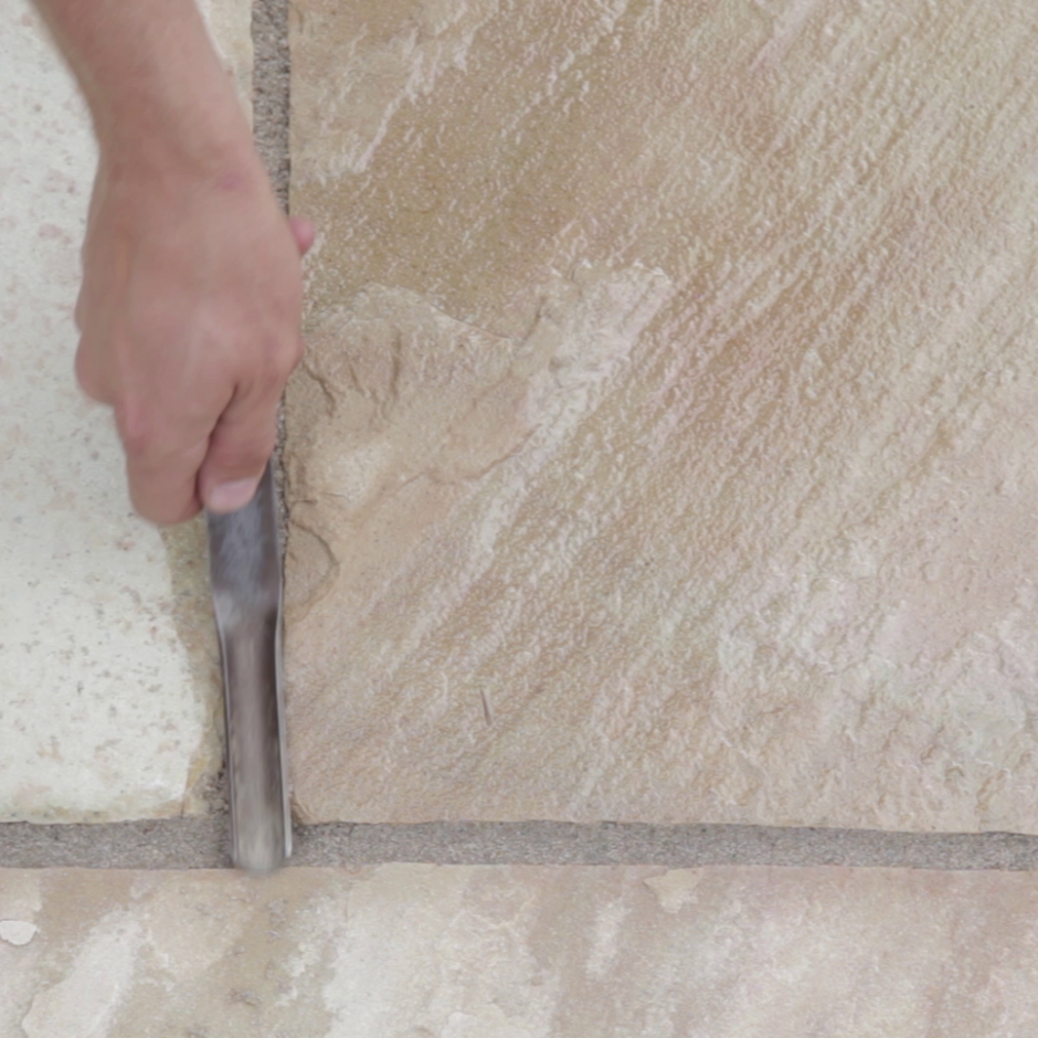 Azpects Easy Joint, Mushroom, 12.5kg tub applying grout to paving