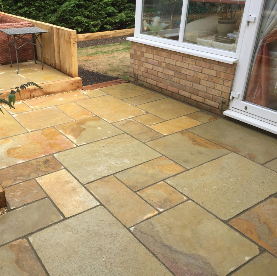 thai yellow limestone paving with grouting in back garden