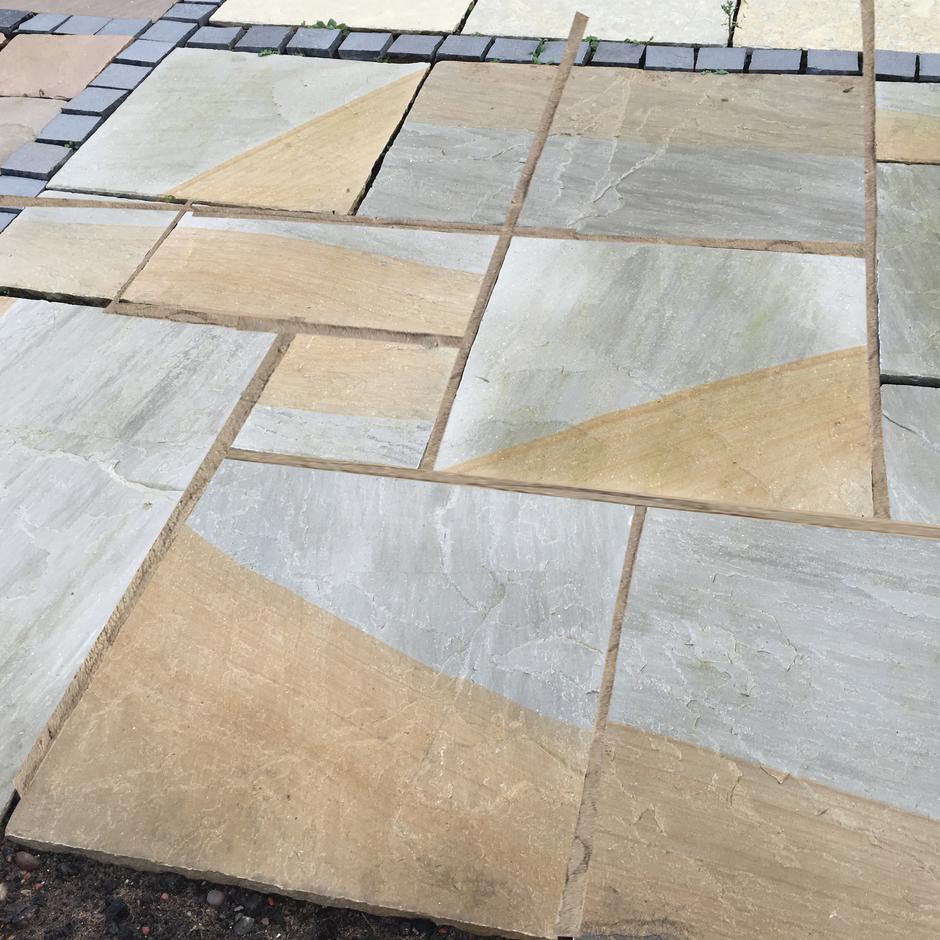 Mocha Sandstone Paving patio. Light brown and grey. Grey sandstone paving slabs