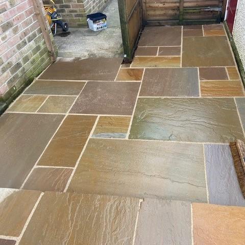 shiny finish sandstone paving in garden