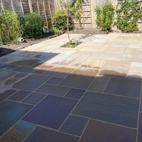 natural stone paving in garden with foliage
