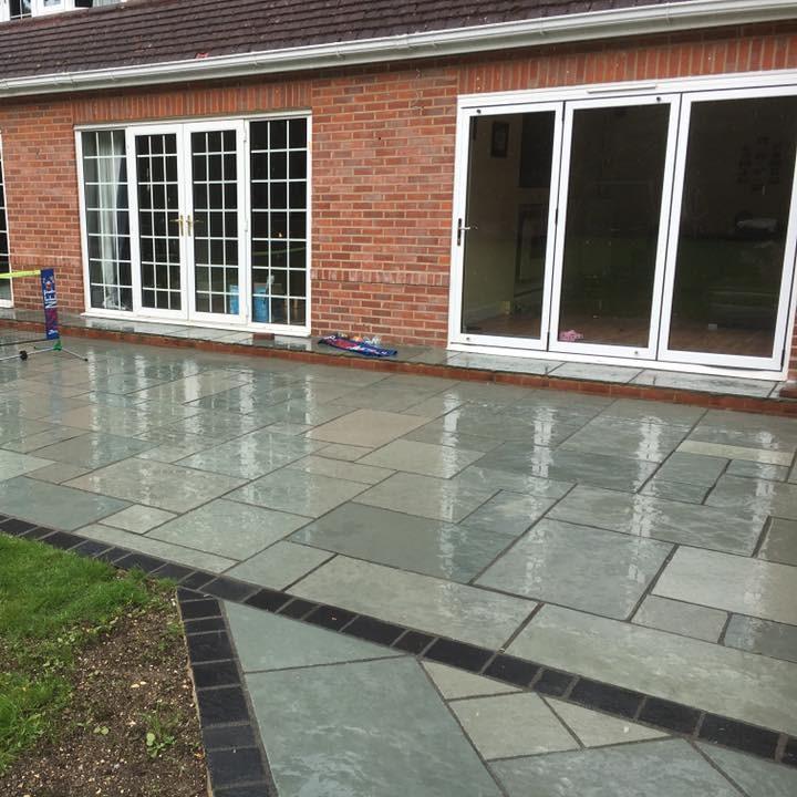 Wet aqua blue limestone with grout for back garden patio