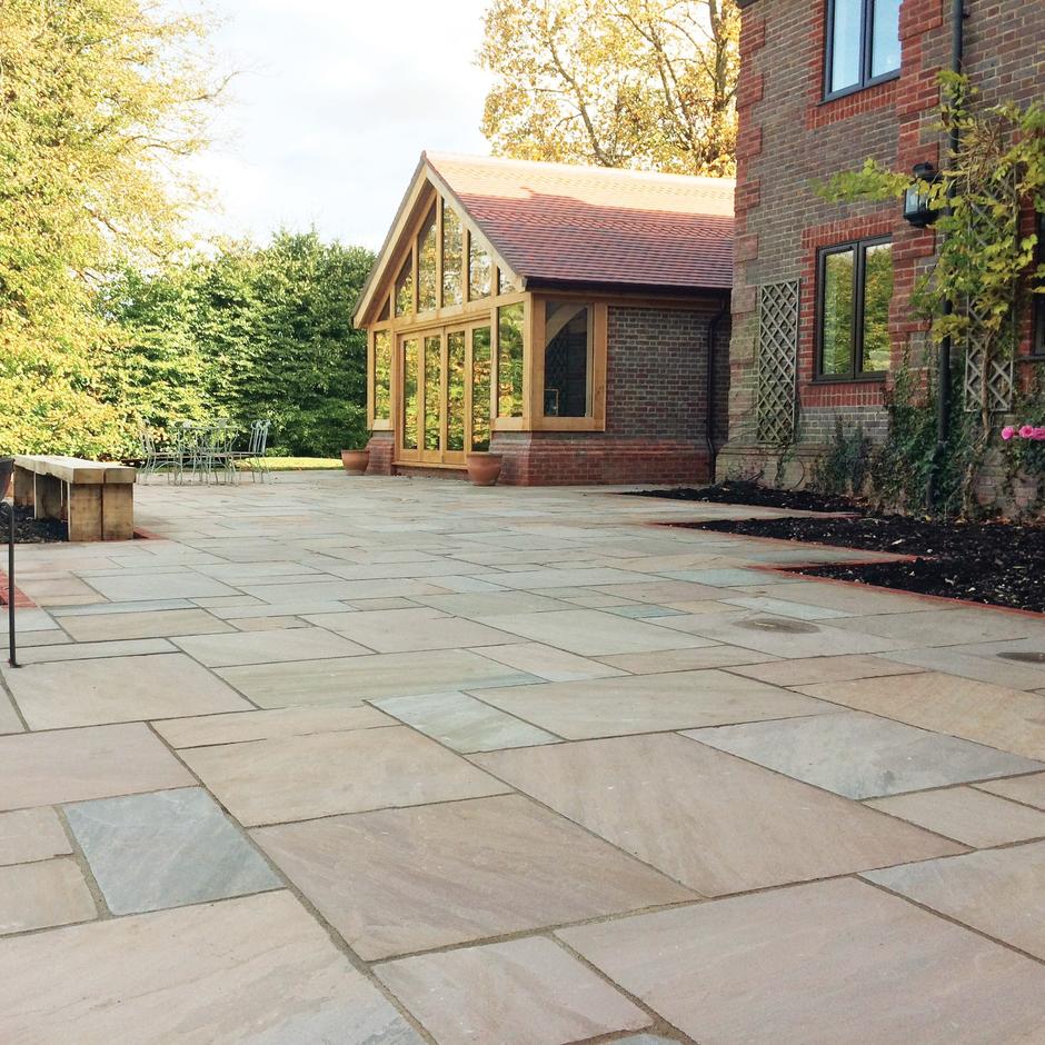 Weathered Fernlea Paving light brown and beige with grouting in back garden